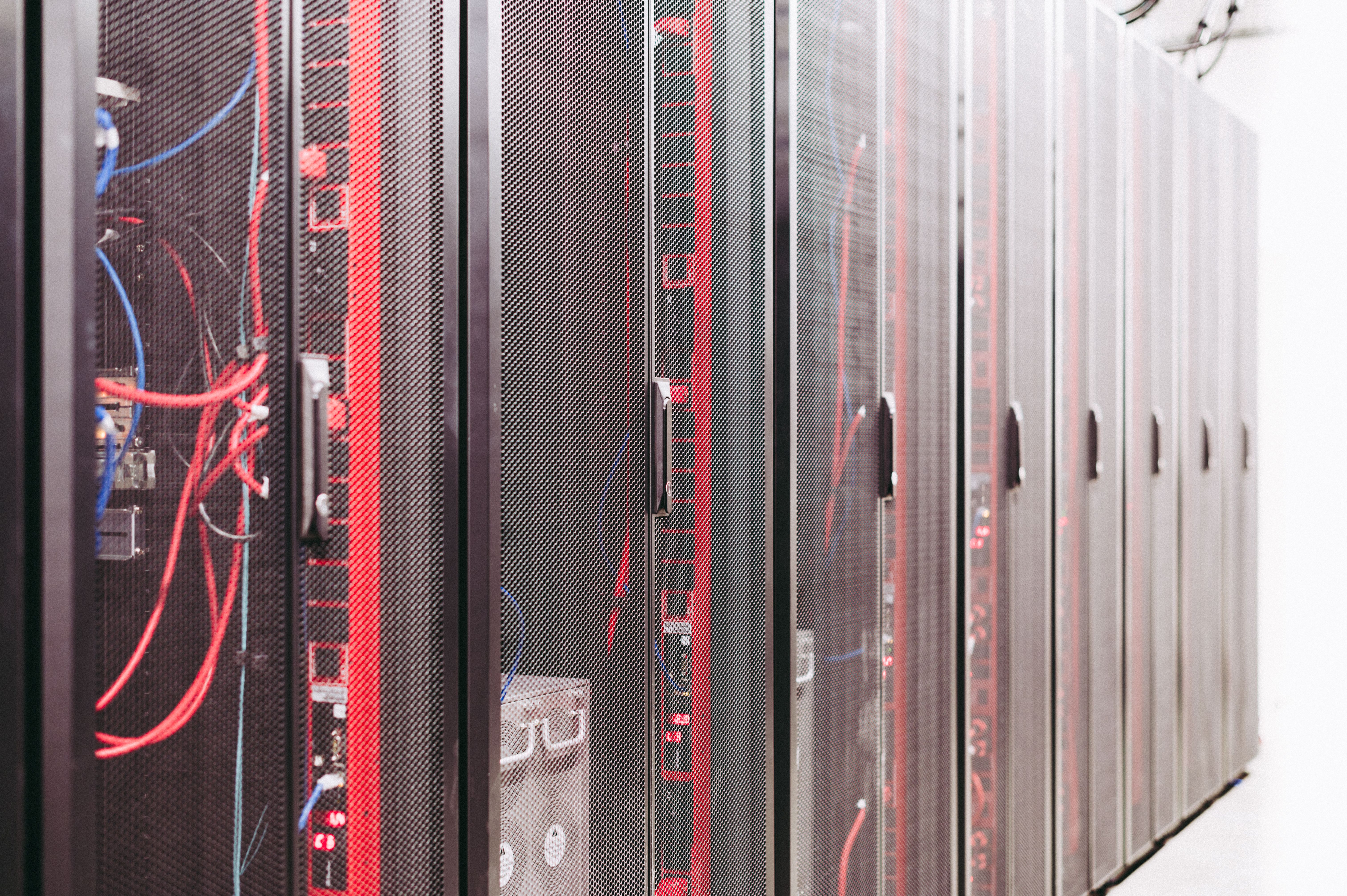 Network racks and cables representing PTC Windchill cybersecurity